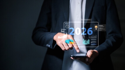 Businessman using smartphone with 2026 financial chart and smart city hologram interface.