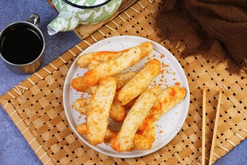 Plate of freshly cooked Indonesian otak otak fish snacks arranged neatly for food presentation and culinary concepts.