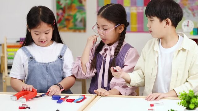 Children Conduct Magnet Experiment in Bright Classroom Science Activity
