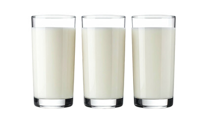 Three transparent glasses filled with white liquid against a black background