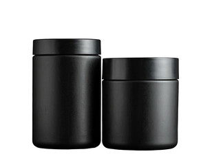 Two black cylindrical jars with lids, minimalist studio shot