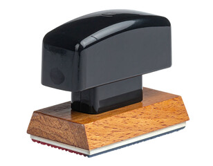 A black rectangular stamp sits atop a stained wooden base