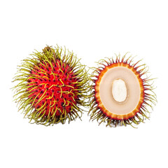 Red rambutan fruit with green hairy skin and one halved showing the white flesh and seed. Tropical fruit for healthy eating and natural snack concept.