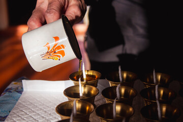 Buddhist Altar Candles at Religious 108 Butter Lamp Festival in Temple Monastery. Pouring Melted Butter Oil. Preparation process