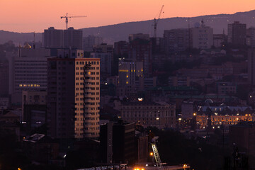 Urban development of Vladivostok at dawn. Bright dawn in Vladivostok.