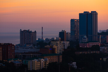 Urban development of Vladivostok at dawn. Bright dawn in Vladivostok.