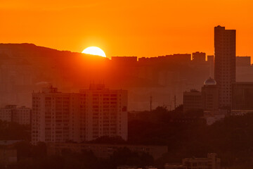 Urban development of Vladivostok at dawn. Bright dawn in Vladivostok.