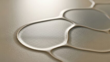 Abstract Embossed Surface: A close-up view showcasing an abstract design of smooth, fluid shapes embossed onto a metallic surface, creating a play of light and shadow