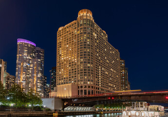 Night in Chicago city downtown. Skyscraper architecture. Chicago city cityscape. Cityscape night with skyscraper building. Skyline architecture. Chicago city with illuminated towers © be free