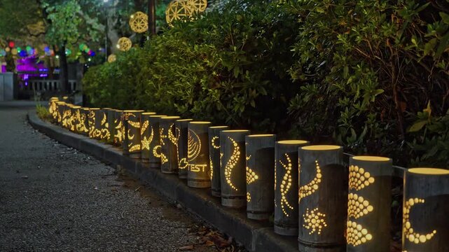 Artistic bamboo lanterns and colorful spheres light up Sumida Park near Tokyo Skytree for a winter festival.