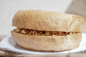 Bread with peanut and butter spread on a table for breakfast	
