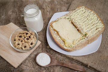 Bread with scrambled egg sandwich on a plate for breakfast and coffee break	