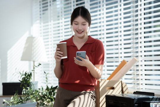 Asian office worker  important documents in a modern workplace, demonstrating confidence, analytical skills, and responsibility while performing consulting, finance, or accounting duties with focus