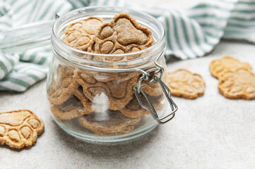Homemade dog paw print treats in jar