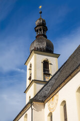 Fototapeta premium Historic Parish Church of St. Sebastian against blue sky in Ramsau village near Berchtesgaden, Germany.