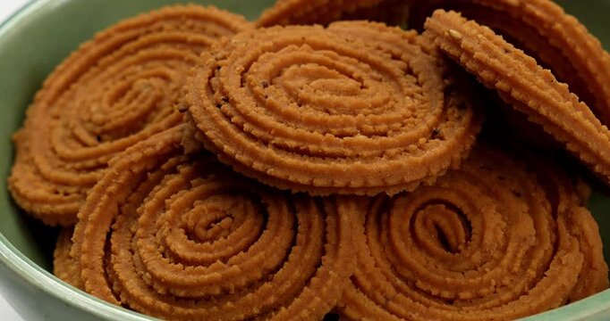 Chakli is a savoury snack from India. It is a spiral shaped snack with a spiked surface