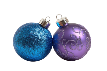 Two sparkling holiday ornaments, one blue and one purple, ready for festive decoration isolated on transparent background