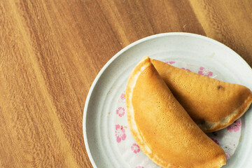 Traditional Sweet Pancake Snack Close-Up on wood table with copyspace