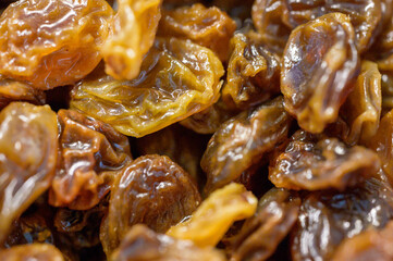 Close up macro shot of dry raisins. Healthy food ingredient in detailed view.