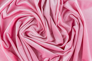 Luxury velvet fabric in pink. elegant soft pleats of velvet material. Abstract fabric background. top view.