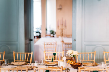 Beautiful table set for dinner with flowers
