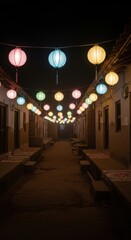Colorful paper lanterns illuminate a narrow street at night, creating a festive atmosphere.