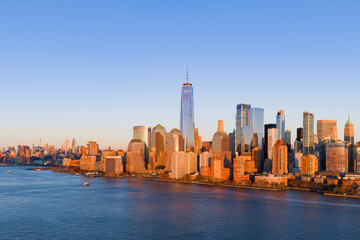 Obraz premium Manhattan downtown panoramic view in New York City at dusk. Manhattan panorama in New York City. NYC Manhattan skyline panoramic dusk view. Manhattan skyscrapers.