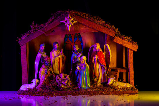 Holy family. Christmas Jesus in crib. Christmas nativity scene of born Jesus Christ in the manger with Joseph and Mary. Traditional Christmas nativity scene of baby Jesus in the manger.