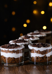 Mini desserts in glass, coffee and chocolate tiramisu with whipped cream