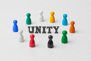 Colorful wooden figures in circle around UNITY text symbolizing diversity