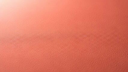 Fototapeta premium Coral pink textured paper or skin background with gradient light. Macro grain surface for cosmetic product, natural organic concept, or bright summer colorful design.