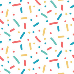 Seamless pattern with confetti sprinkles. Birthday pastel small dash background. Playful vector illustration with cute simple repeat texture for allover print, party design or baby shower background.