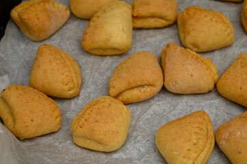 Goose Feet Pastries with Sugar Coating on Parchment Paper