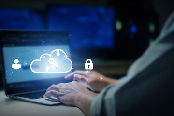 Cybersecurity in Cloud Computing, person using a laptop with a digital cloud and data protection interface. modern cybersecurity and cloud computing technologies in action.
