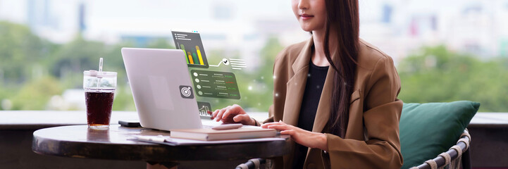 Asian business professional analyzing digital data on laptop with interactive augmented reality interface modern technology smart solution