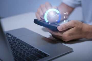 Naklejka premium Super Fast internet connection speed test bandwidth network technology, Man using Internet high speed by smartphone and laptop computer, 5G quality, speed optimization. performance, speed, test.