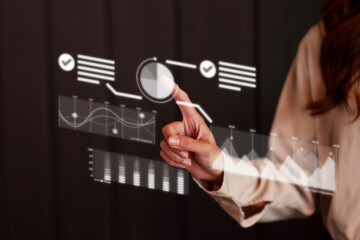 Adult Asian business professional analyzing virtual data charts for strategic financial growth and market planning