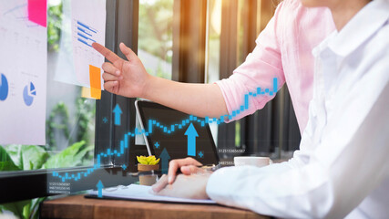 Business professionals analyzing financial market data discussing growth strategy reviewing performance reports collaborating in modern office setting