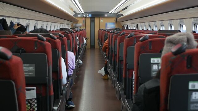 interior view inside Highspeed bullet train full with passenger sitting in train commuters while train moving running in high speed,japan public train transportation from inside