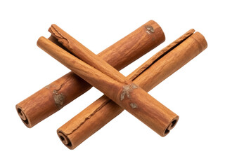 Isolated Cinnamon sticks of aromatic bark spice crossing on table, culinary ingredient food