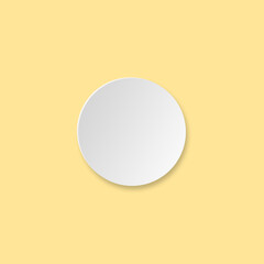 A white circle resembling a food plate is placed on a warm yellow background.
