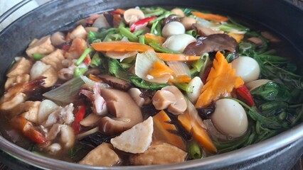 Kangkung hotplate with seafood in chinese restaurant