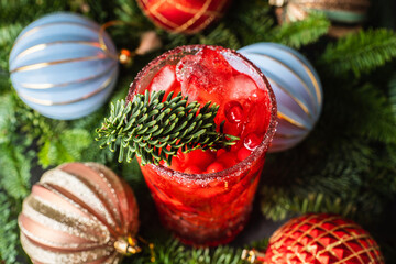 Tasty christmas cocktail with cranberry and foxberry. Shallow depth of field. Selective focus.