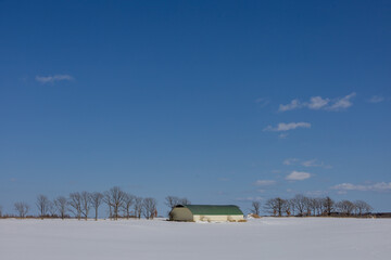 A winter barn in the snow