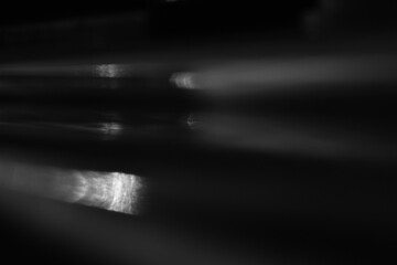 Horizontal Motion Light Blur Background. Abstract horizontal motion light blur in black and white. Cinematic overlay background for dynamic modern design, video editing and visual effects.