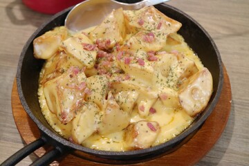 Close-Up of Potatoes with Cheese and Bacon