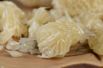 peeled ripe and juicy grapefruit pulp broken into pieces, pieces and slices of ripe grapefruit on the table
