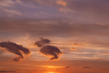 multi-colored sunset with different colors and clouds as the sun sets over the horizon, multi-colored sky with warm colors and a touch of sunset or sunrise