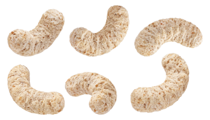 detailed photograph showcasing a group of nutritious whole grain cereal pieces arranged artfully on a black backdrop for visual appeal