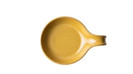 Isolated yellow stoneware spoon rest with handle for stove top or kitchen counter use